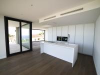floor to ceiling glass kitchen - Costa Brava Overlook - Ballard & Mensua Architecture