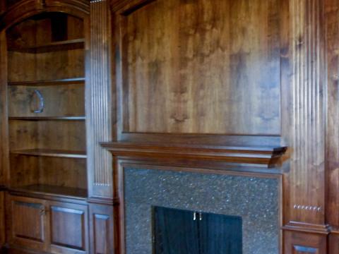 Dark wood sitting room and dark grey fireplace feature for Sugarland Lane