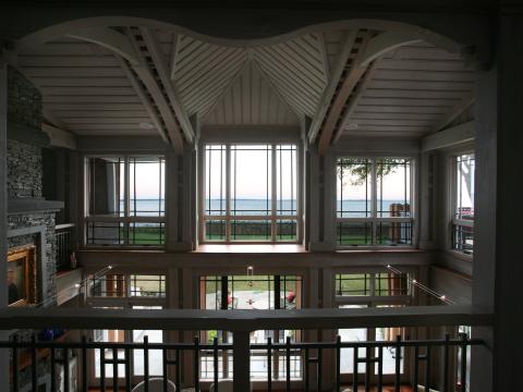 Carr project - nautical New England waterfront home - living bayview windows from second floor