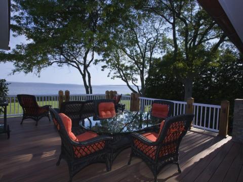 Carr project - nautical New England waterfront home - terrace at sunset