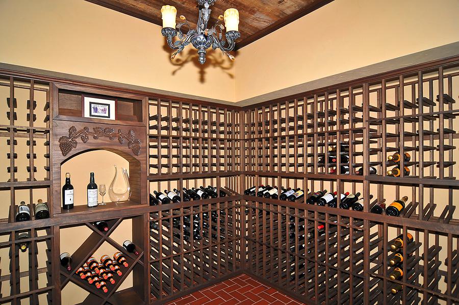 Expansive, dark stained wood wine cellar for Sugarland Lane