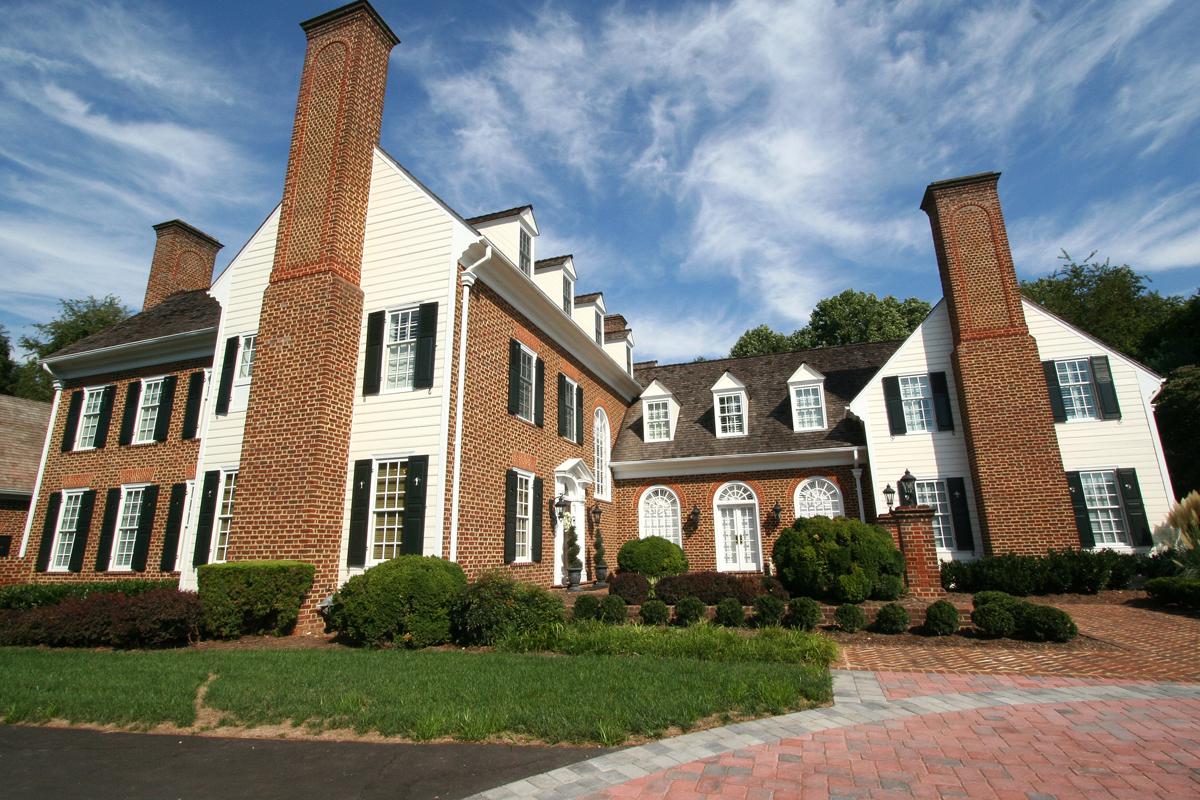 Stately brick entrance to project from Frank M Bell and Ballard + Mensua