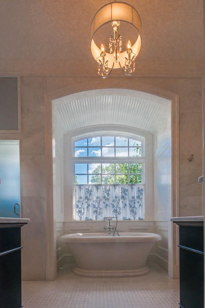 master bathtub with chandelier - McLean waterfront - Graham project