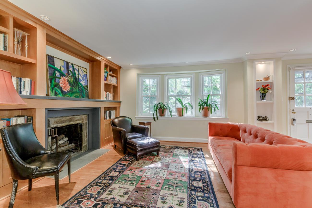 the living room towards three large picture windows - The Shire of Spring Valley - Ballard & Mensua