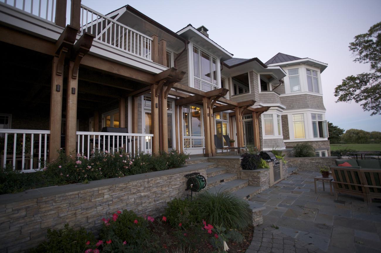 Carr project - nautical New England waterfront home - rear patio at sunset